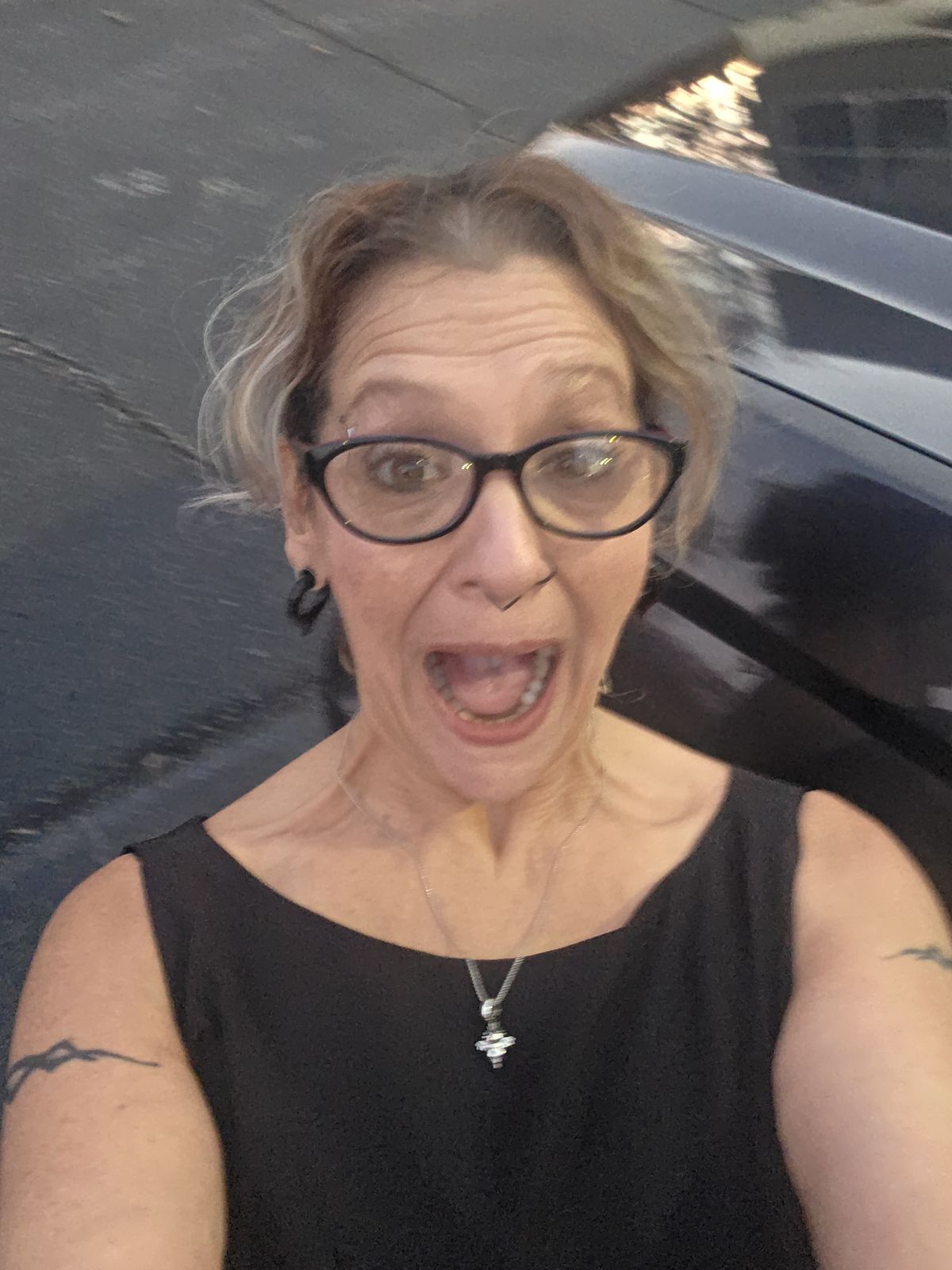 Sandra smiling for a playful selfie